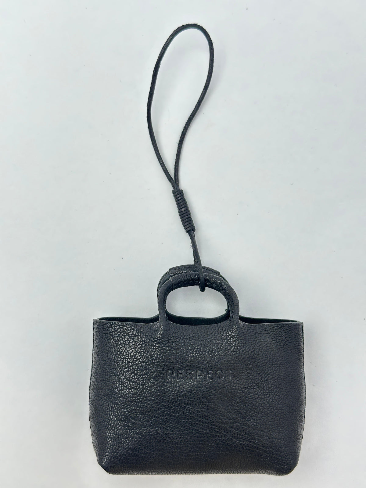 Mini Charm in Black leather — front view