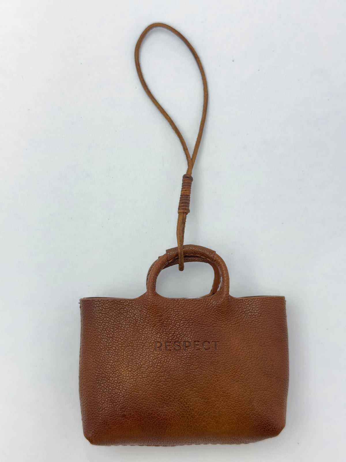 Mini Charm in Safari leather — front view