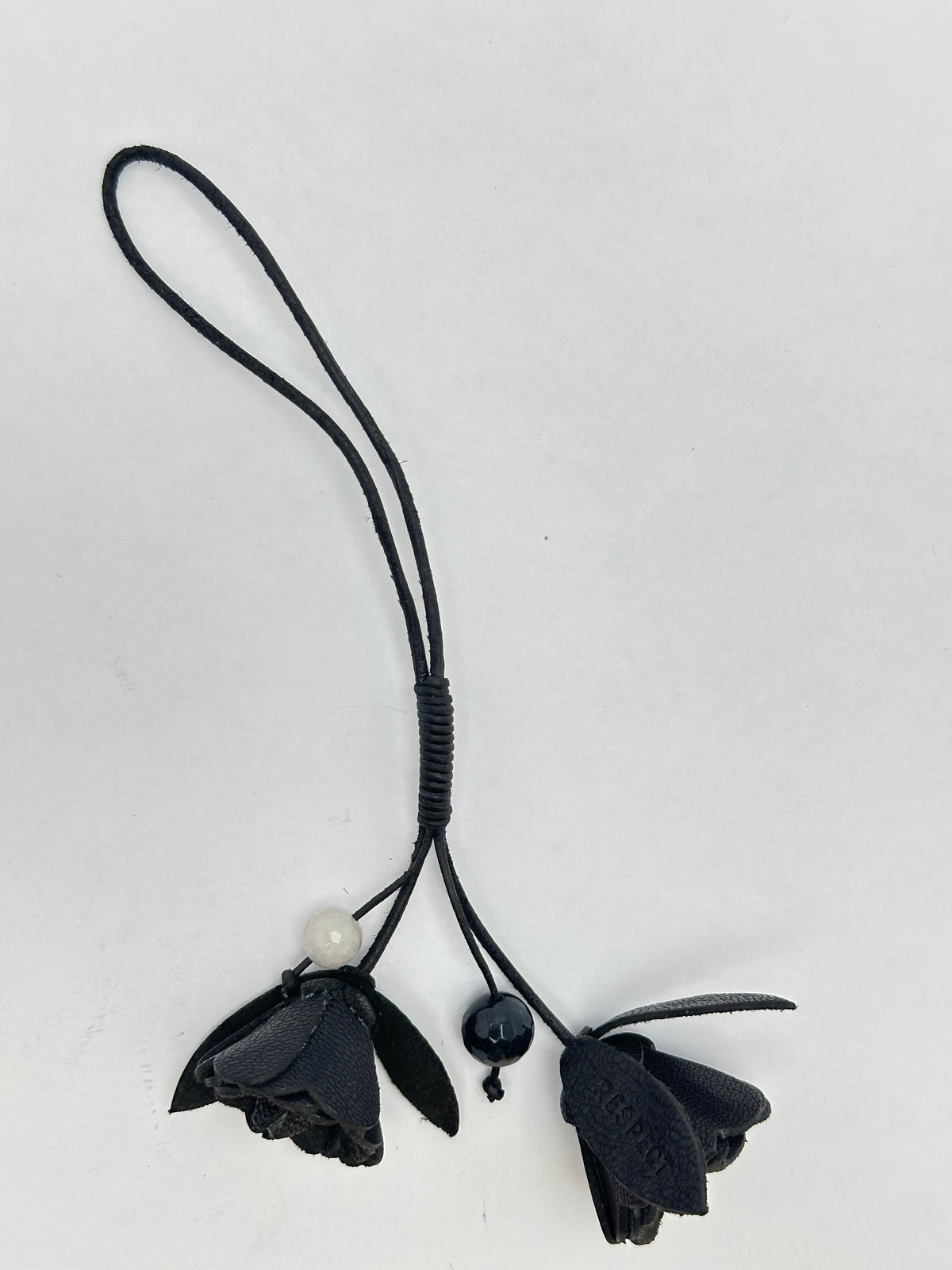 Signature Flower in Black leather — front view