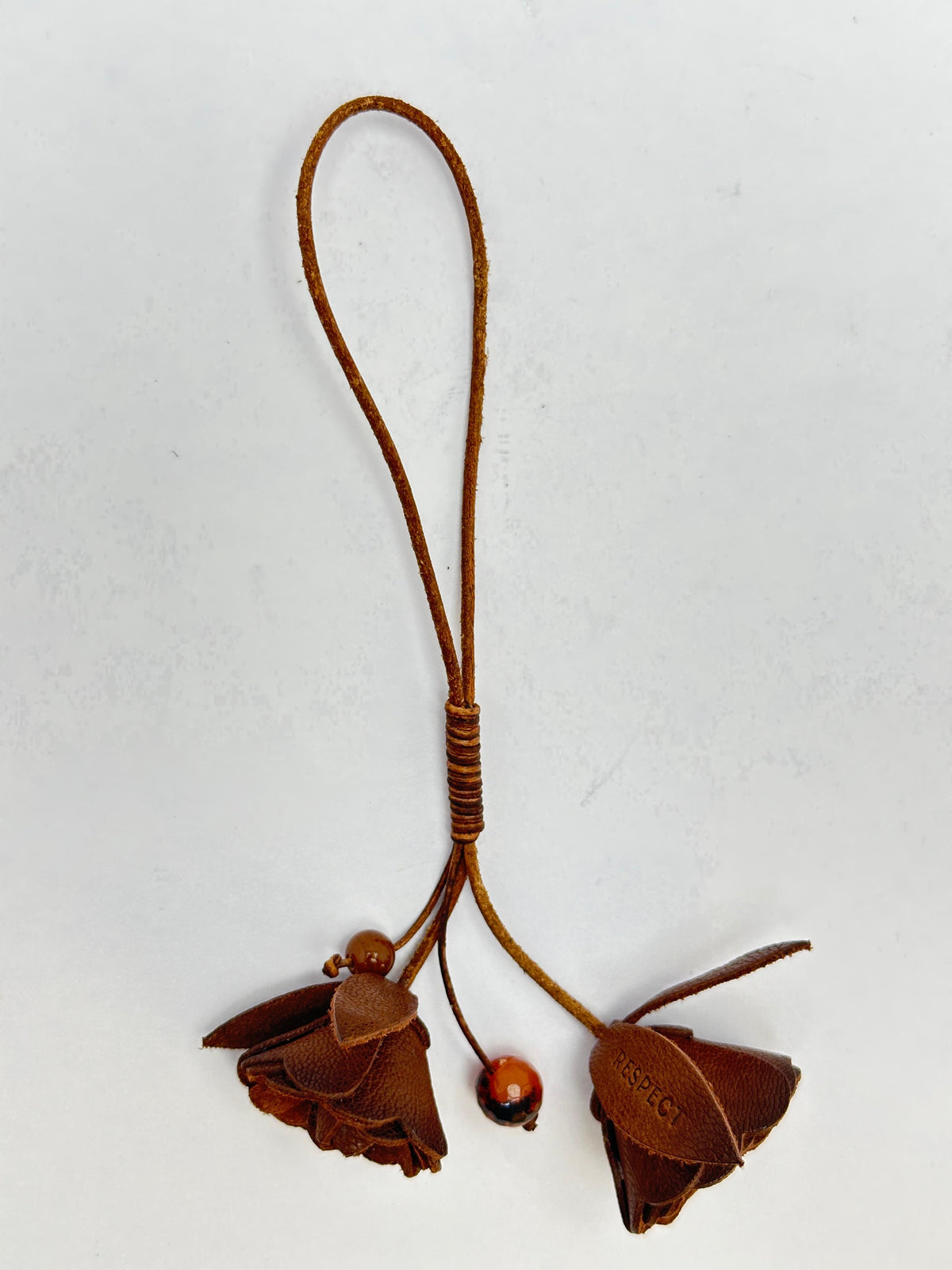 Signature Flower in Safari leather — front view